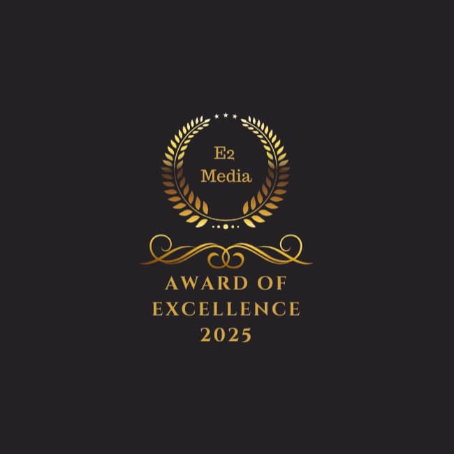 Gold laurel wreath with "E2 Media" inside and the text "Award of Excellence 2025" below, set against a dark background with elegant decorative accents.
